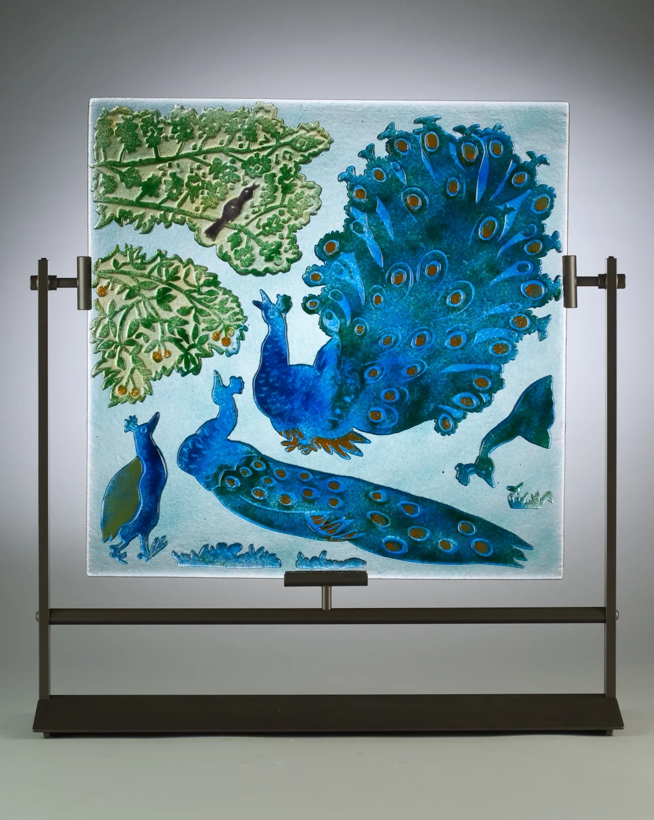 The Peacock Complaint, fused and sandcarved glass with glass enamel, 18x18"