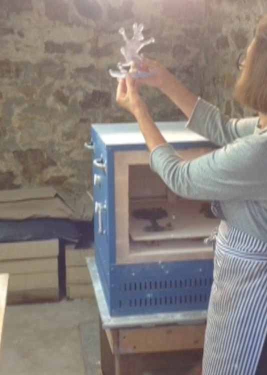 ...and they go back in the kiln to fuse the paint and polish the edges.