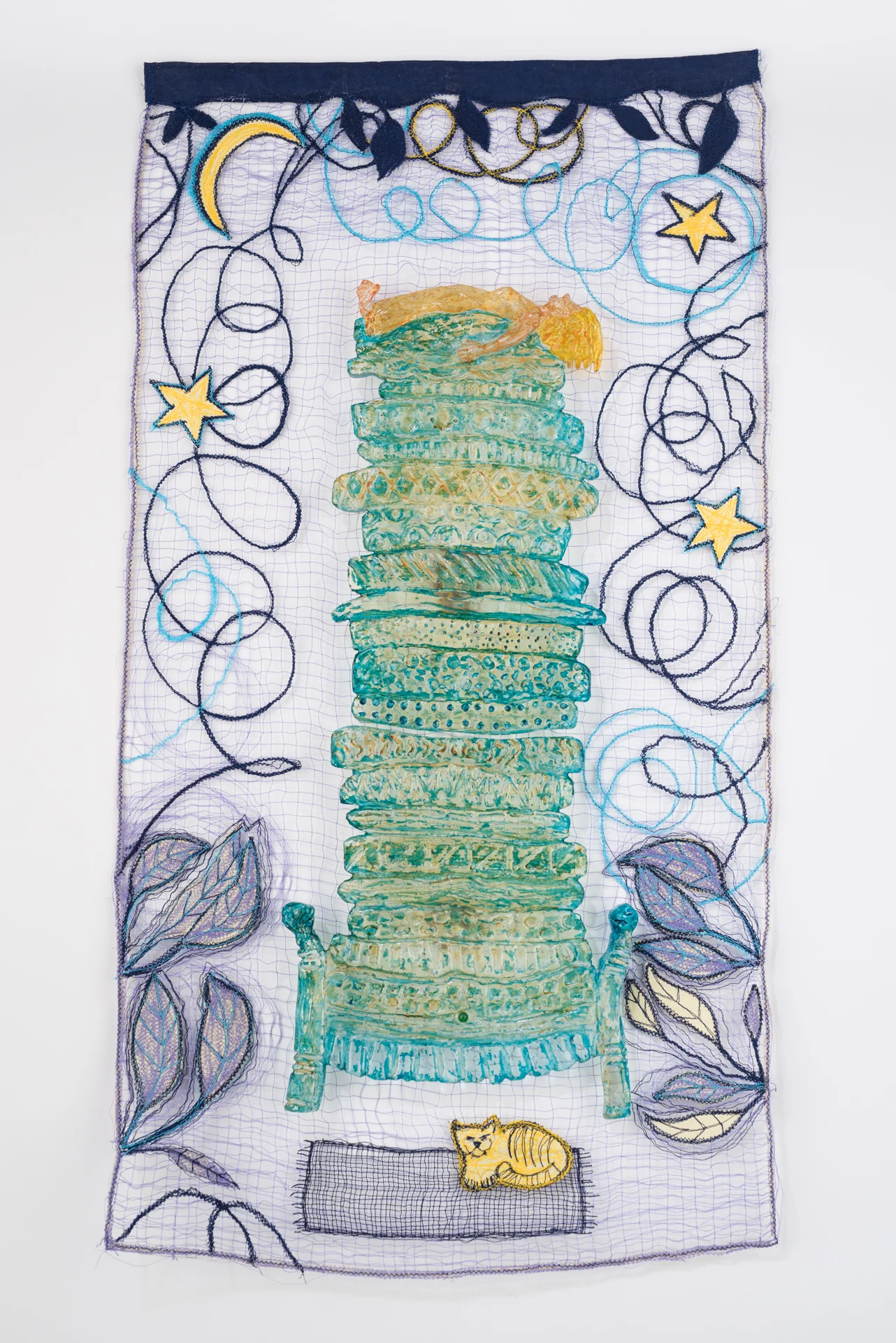 The Princess and the Pea, Cast, cut and painted glass shapes wall mounted over a sewn panel, panel is 14"x 28"