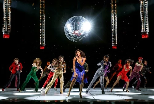 Photo: Ariana DeBose as “Disco Donna” and Company in “Summer: The Donna Summer Musical.” Credit: Joan Marcus.