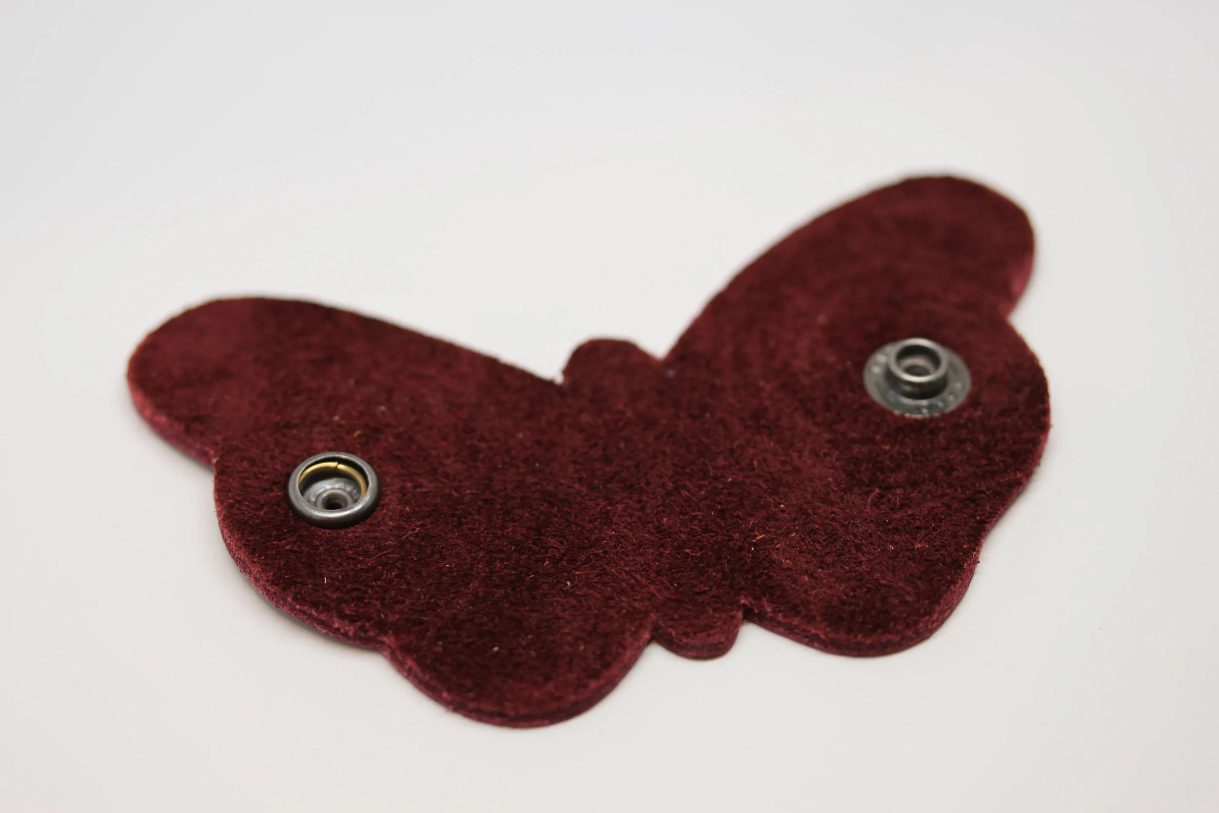 Leather, butterfly, earbud, cord, keeper, organizer, holderLeather, butterfly, earbud, cord, keeper, organizer, holder