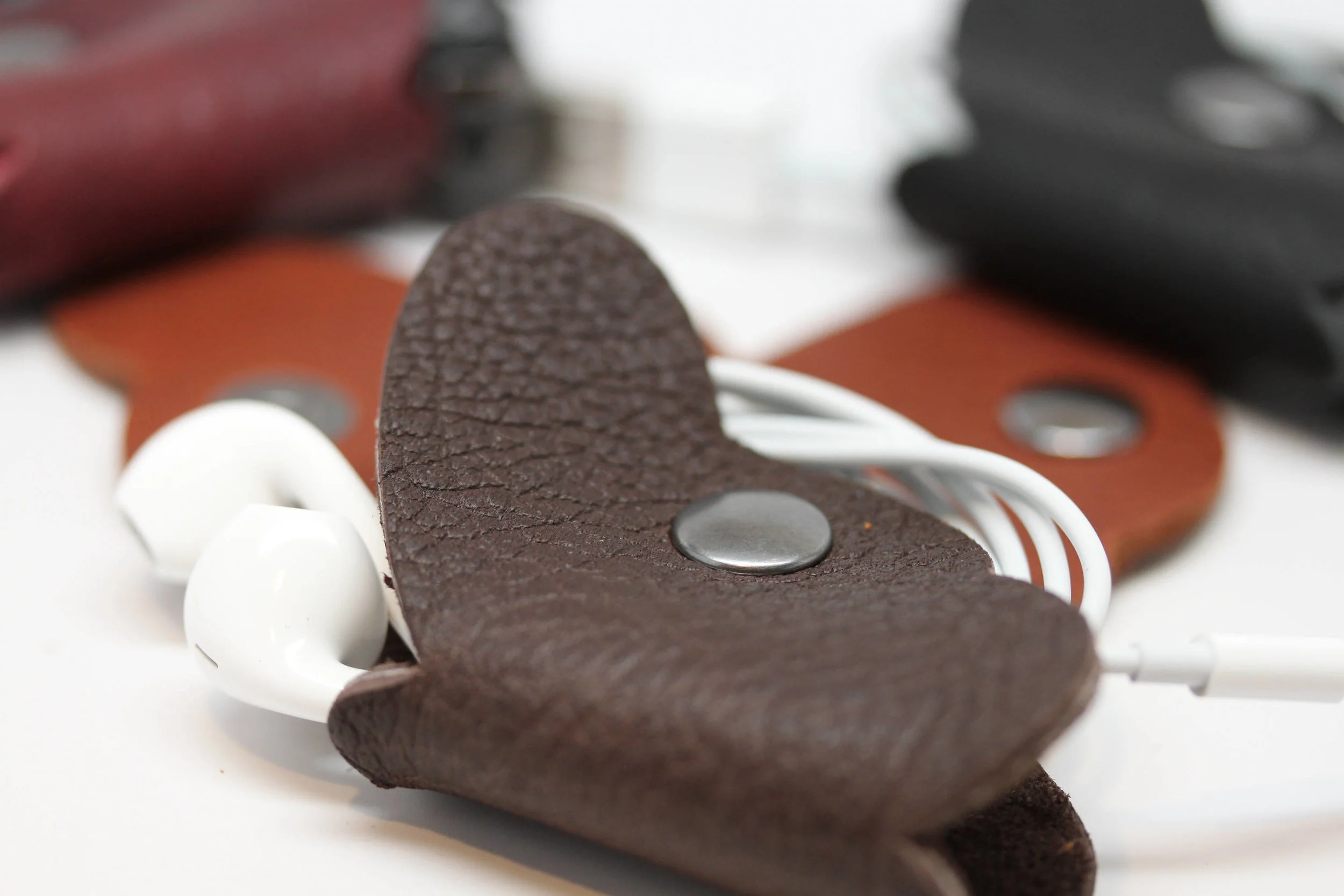 Leather, butterfly, earbud, cord, keeper, organizer, holder