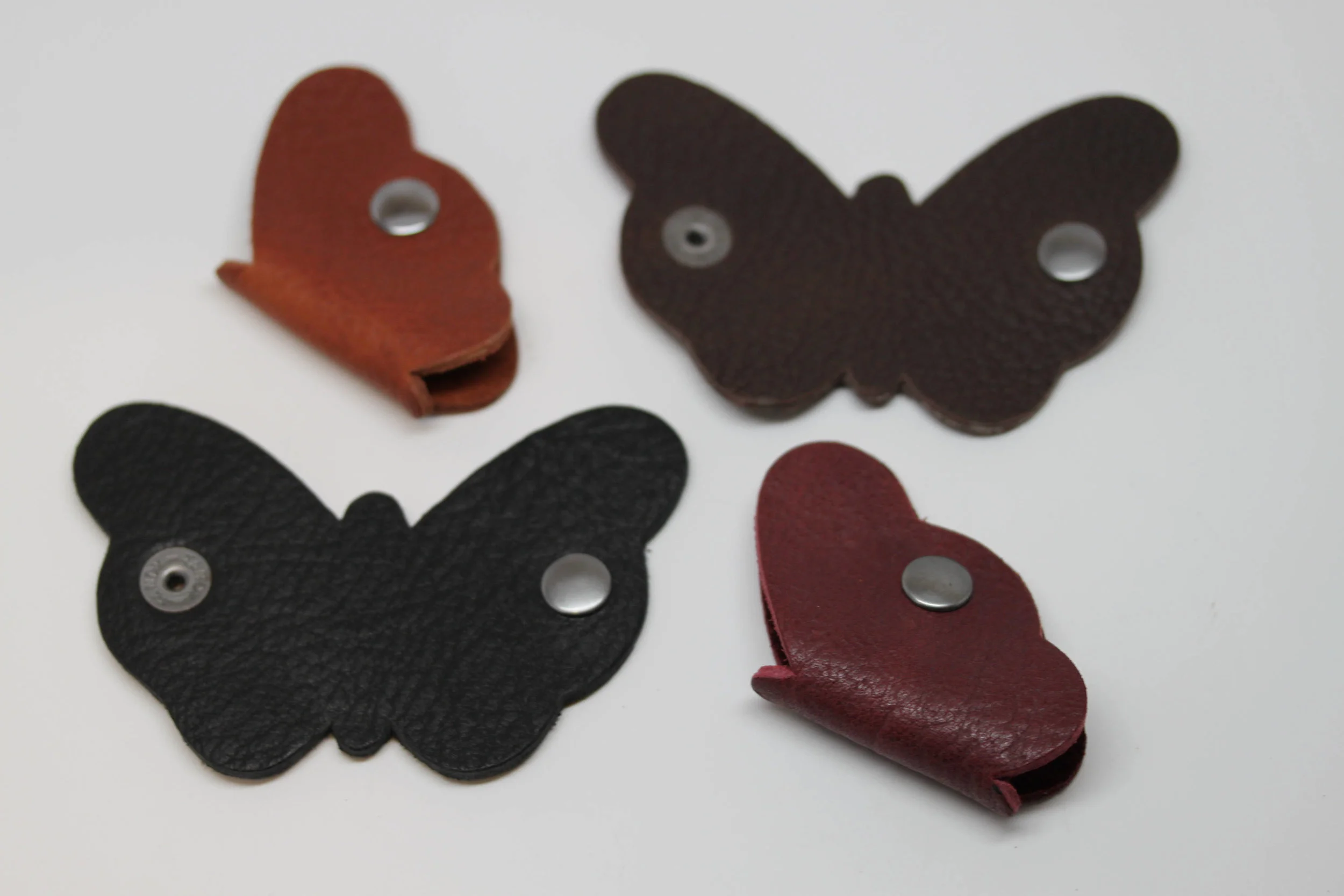 Leather, butterfly, earbud, cord, keeper, organizer, holder