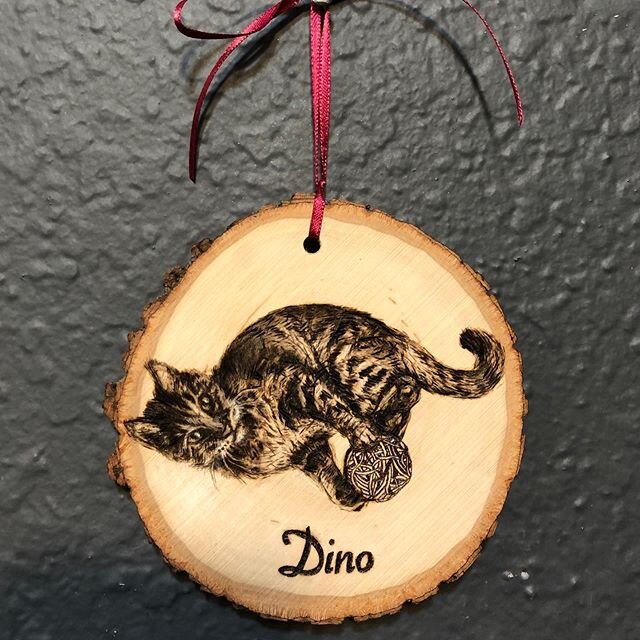 Dino, a hand-burned Christmas ornament