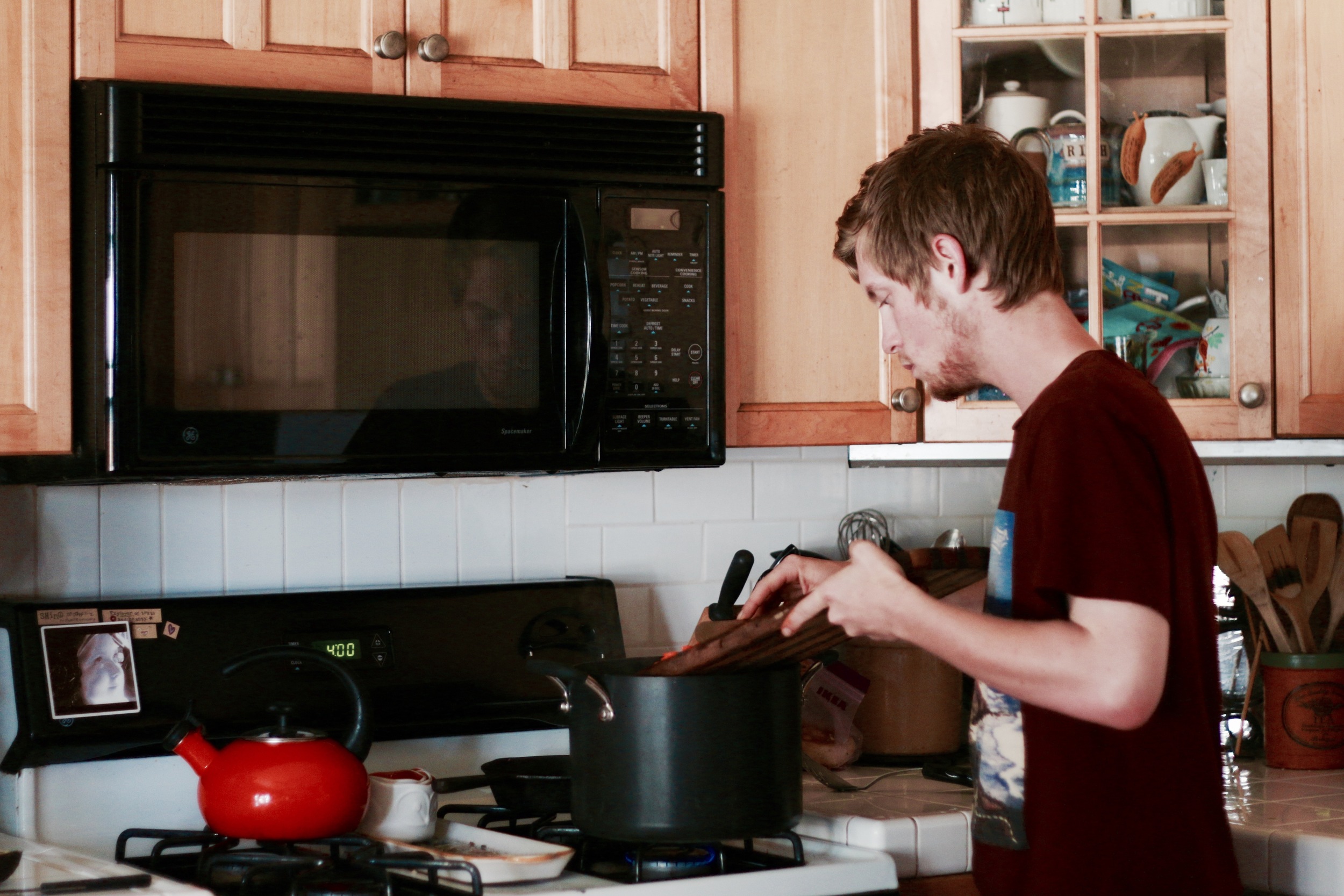 first born helping in the kitchen.