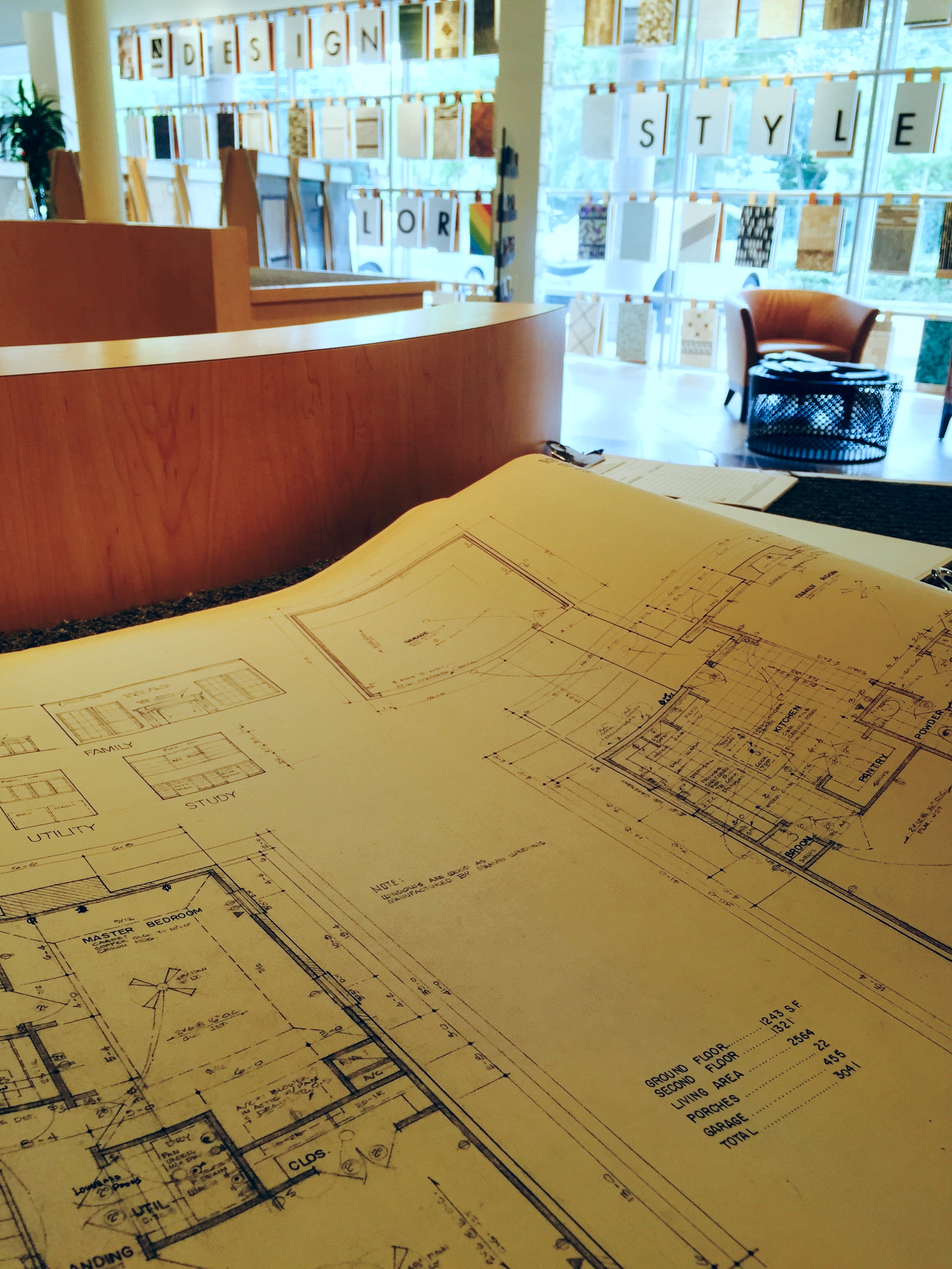 Checking out our original 1986 floor plans while looking at tile options.
