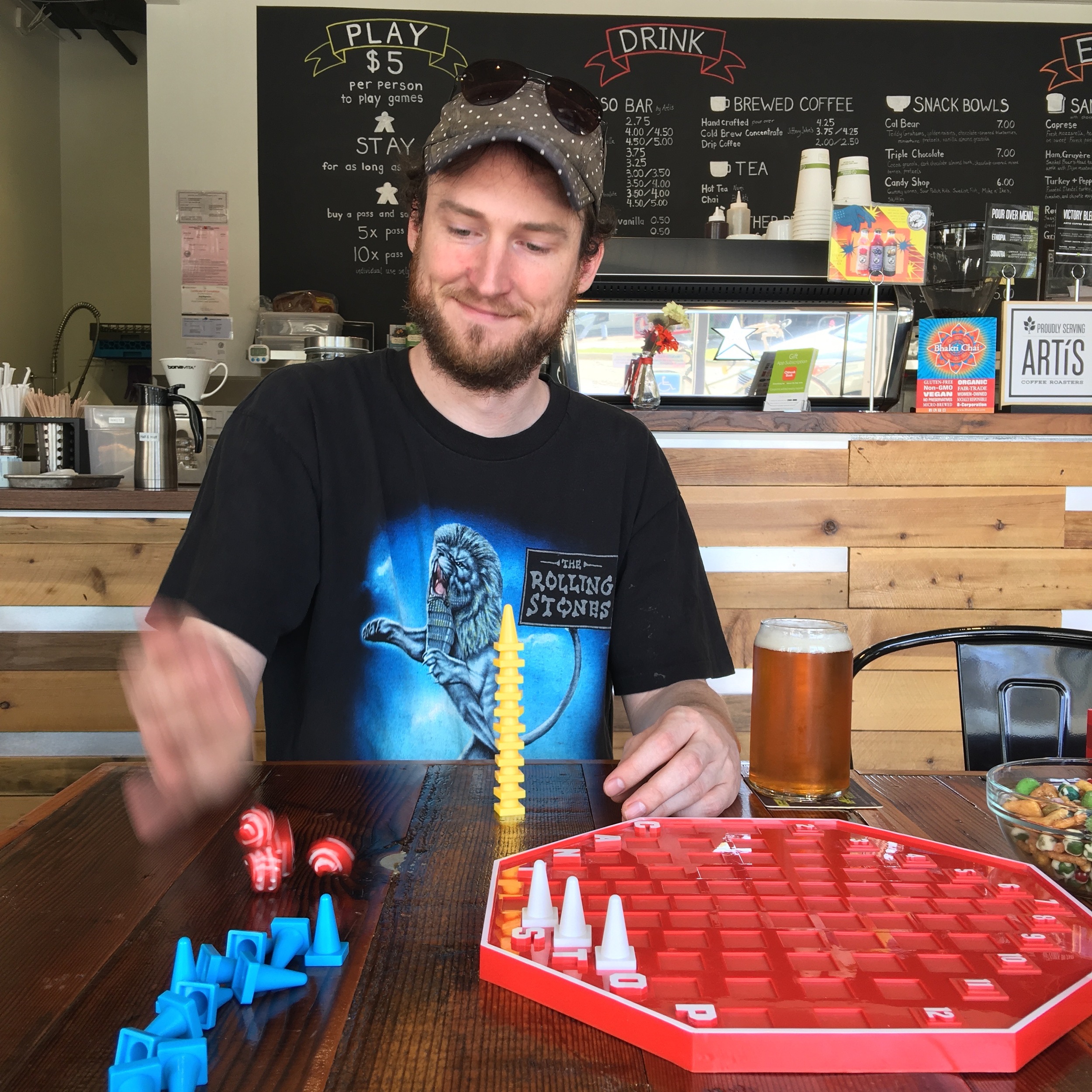 Brandan Parsons of Blue Orange Games playing at Victory Point Cafe