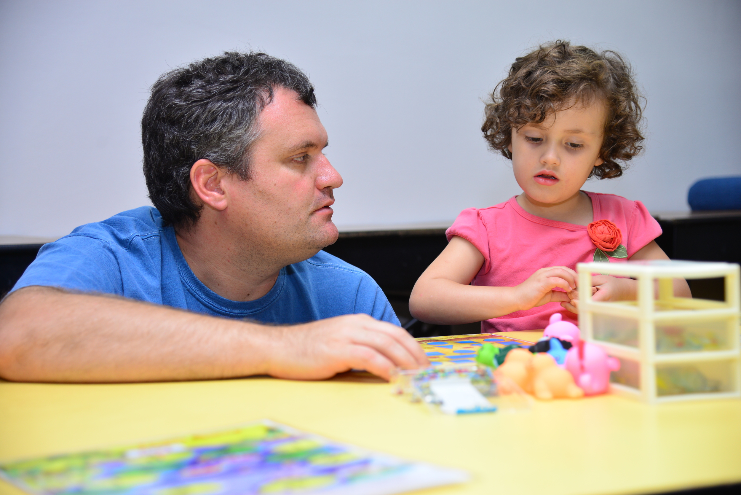 Daddy Andrew working with daughter Abigail.