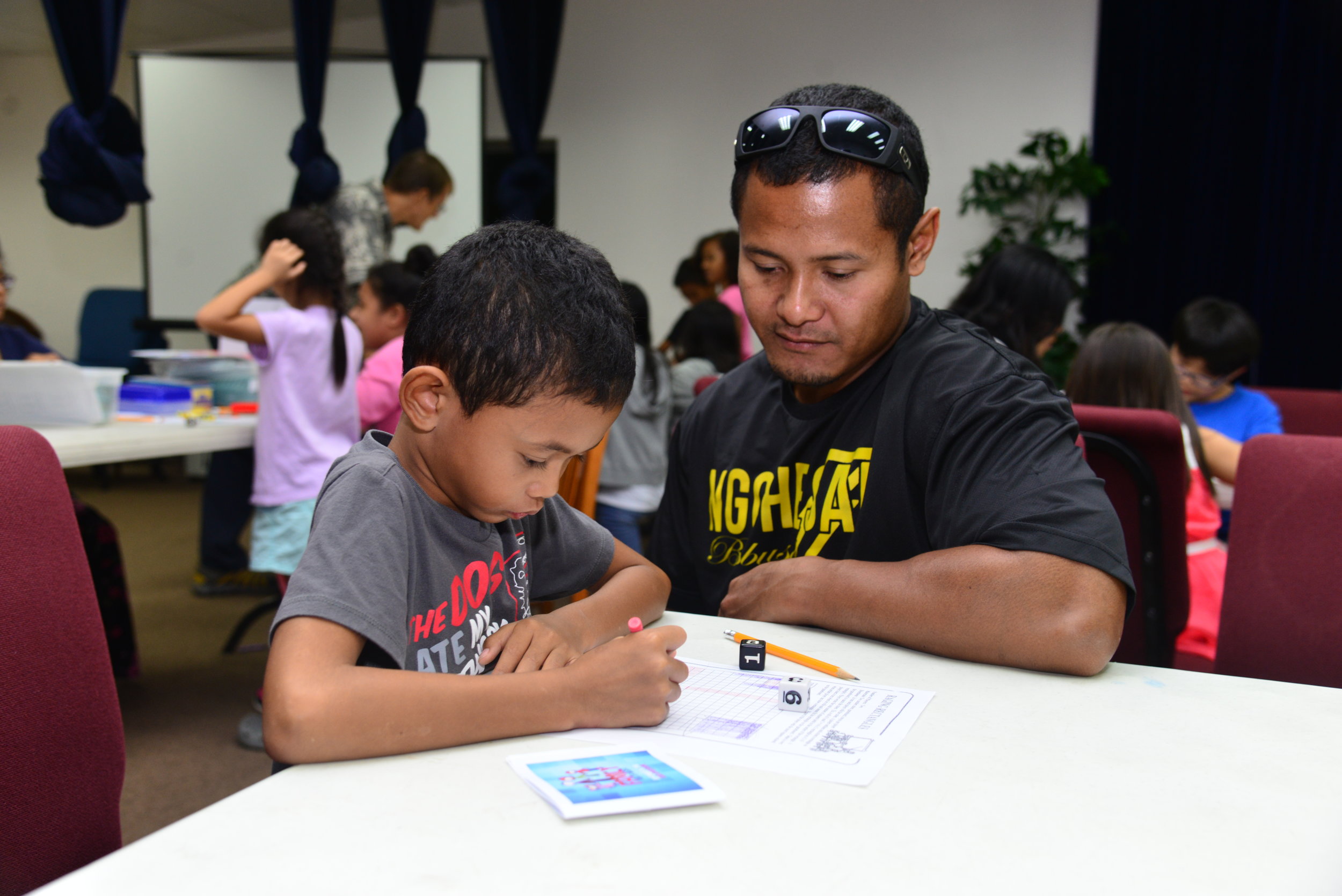 Keani and Dad working on a problem.