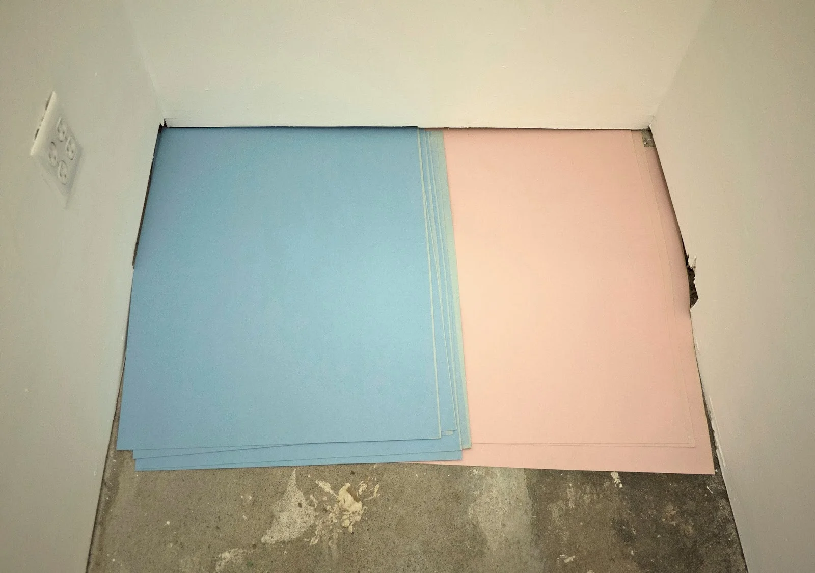 Pink and blue carton faded on the sides from sun light 92cm x 70cm x 0,5cm