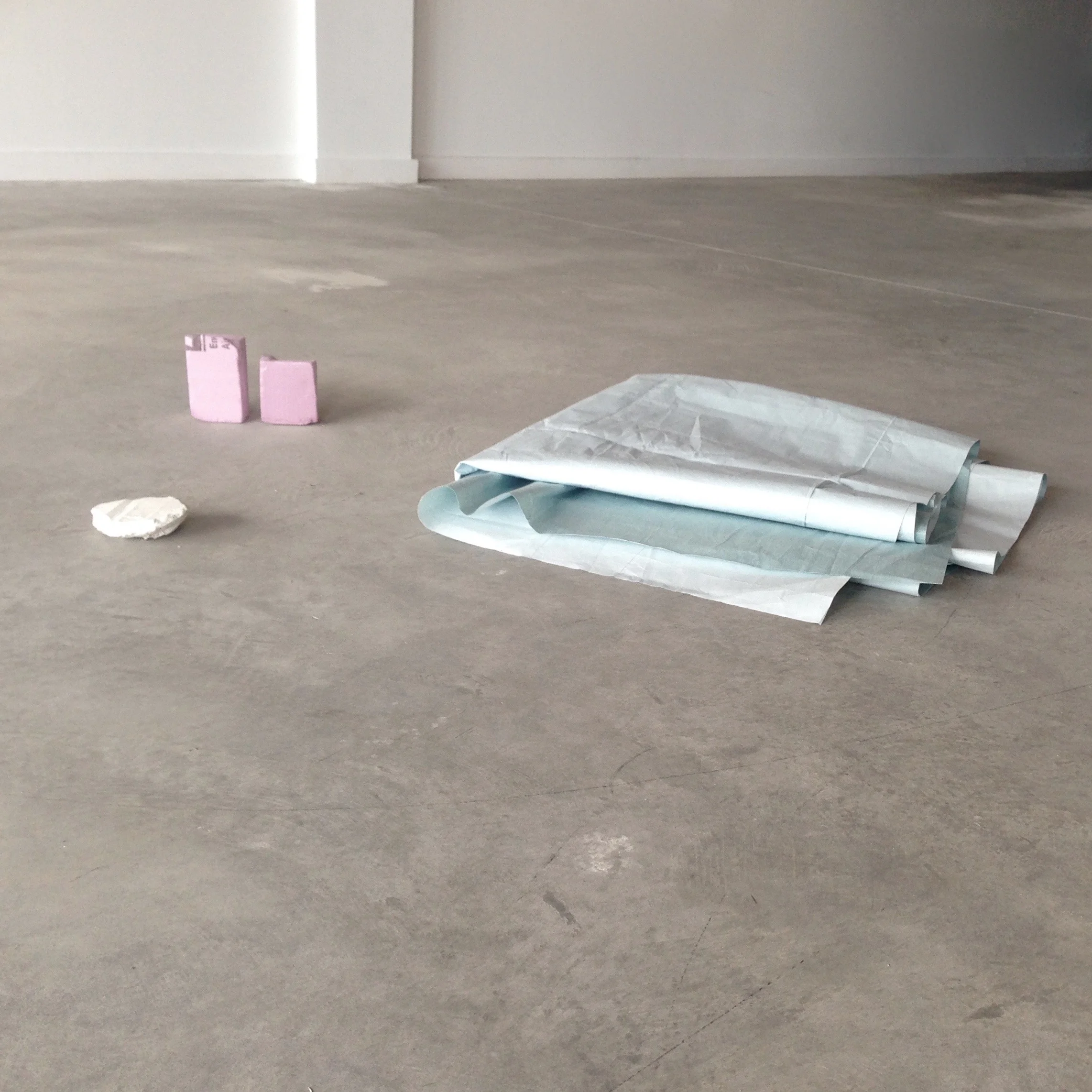 Collection , 2015 Paint cover (appx. 70 x 70 x 8 cm) Styrofoam (13,5 x 20 x 5 cm) Rock (12 x 11 x 4 cm)
