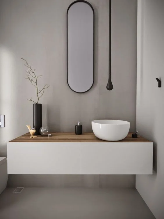 oval shapes create a less conventional bathroom. thin edges and lines with beautiful seamless design