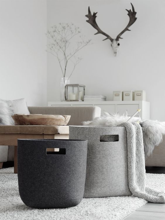 Add some baskets in the living room for winter throws or bits and pieces that find their way into your living space. They're' handy when a quick clean up is in order. 