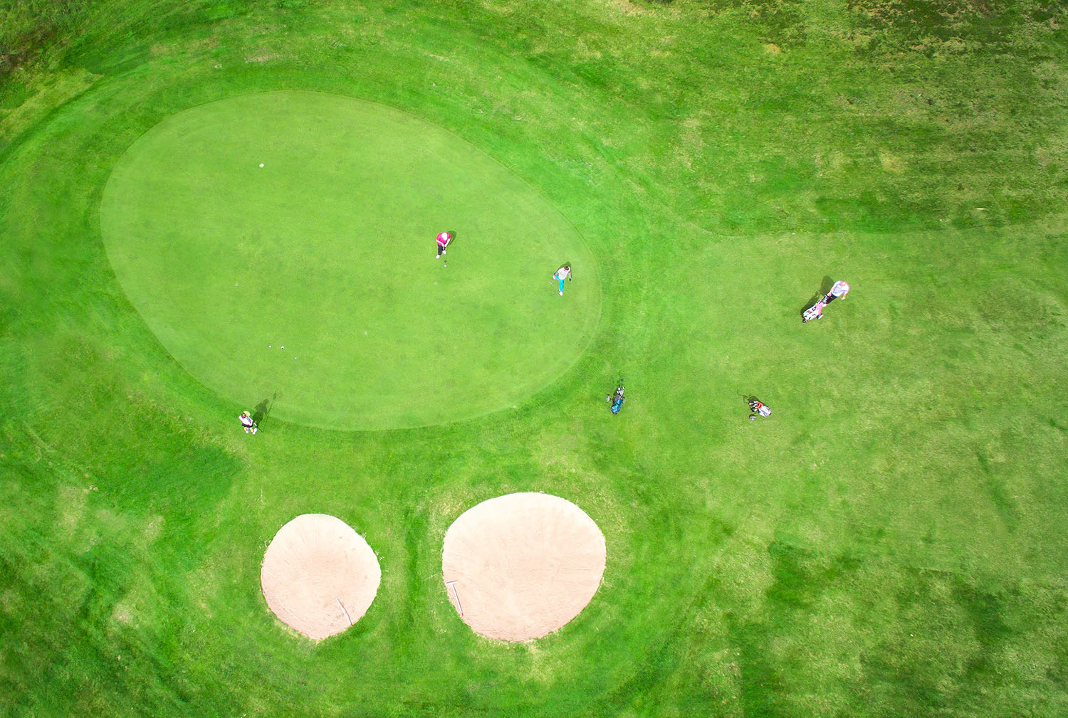  Boat of Garten golf course birds eye view of 7th hole as golfers play. 