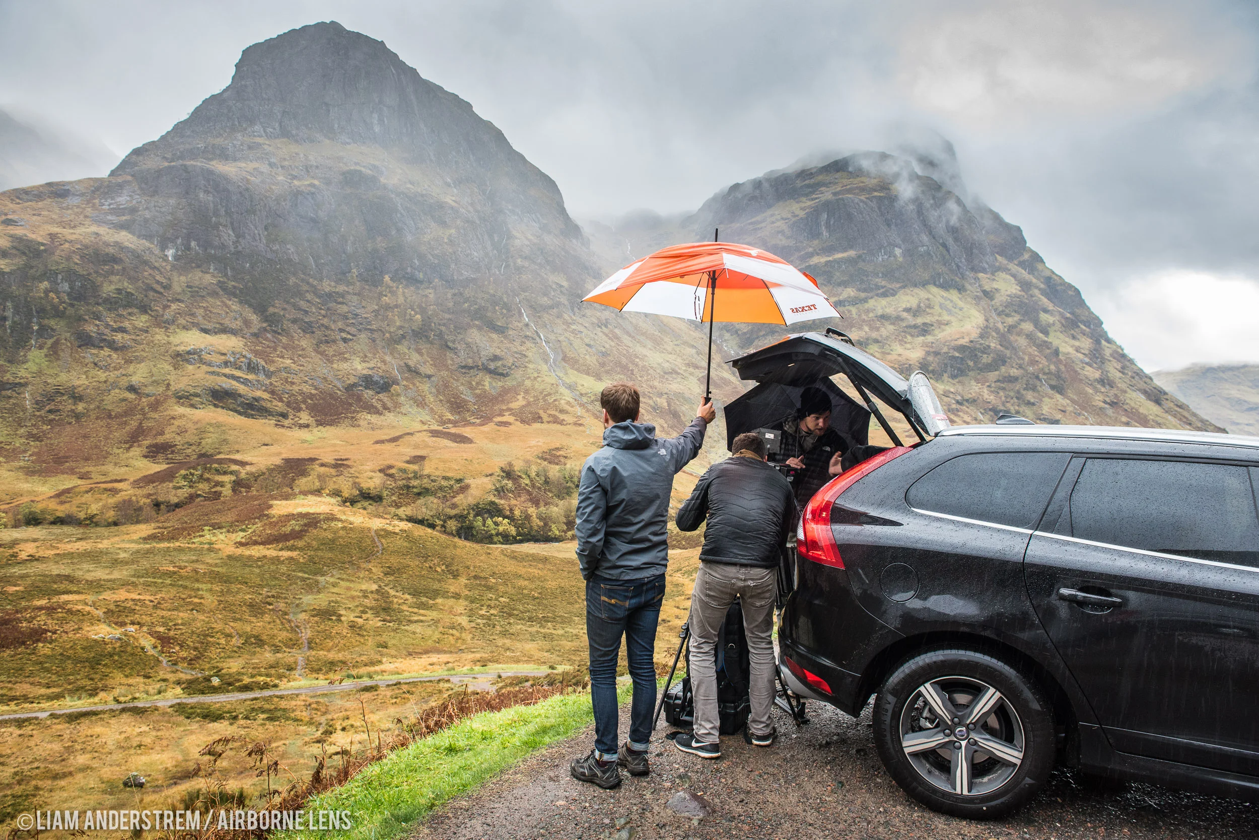 Sheltering from the rain while shooting in stunning Glencoe. The Texas umbrella is Liam's! Image Liam Anderstrem / Airborne Lens 