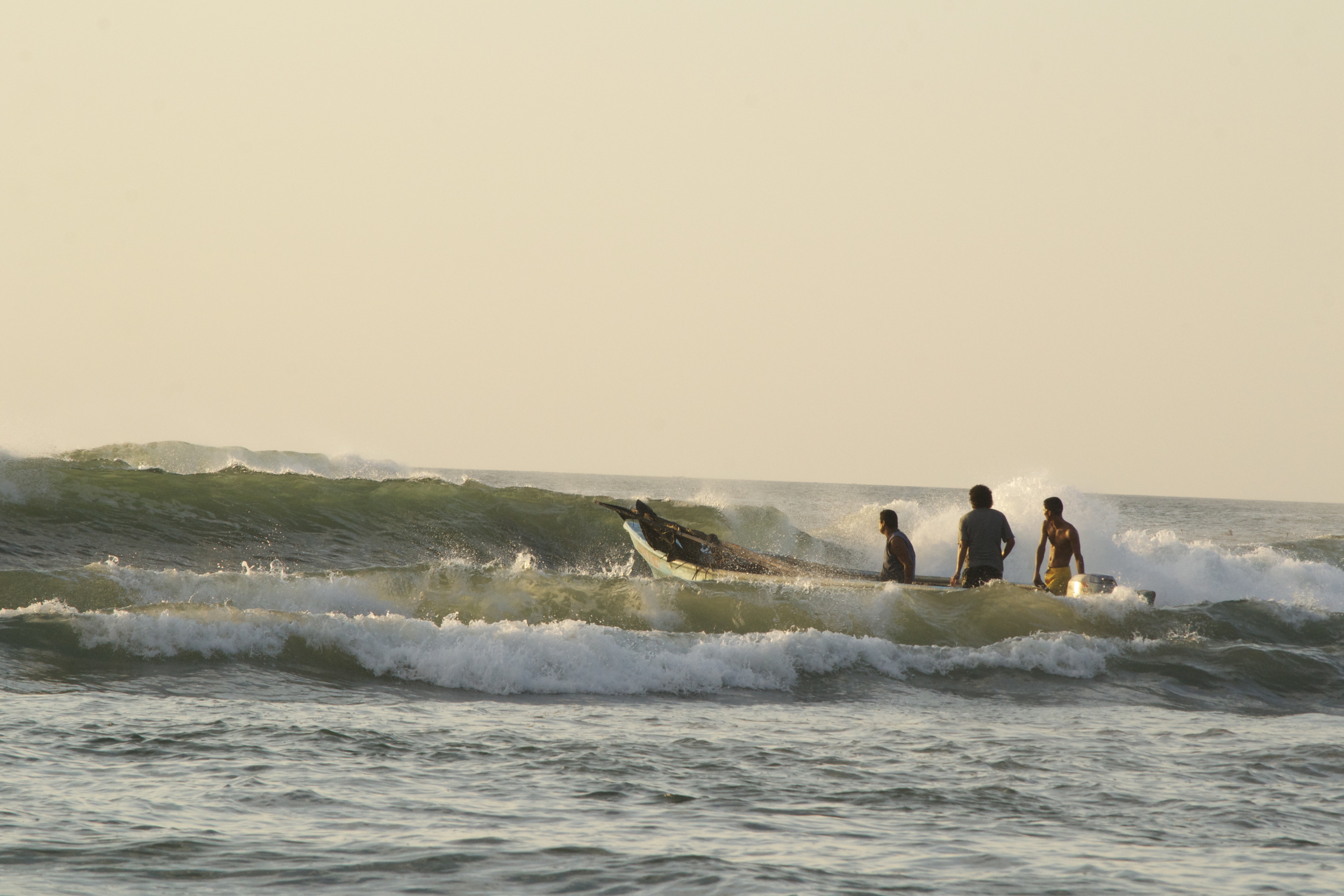 fisher men in waves.jpg