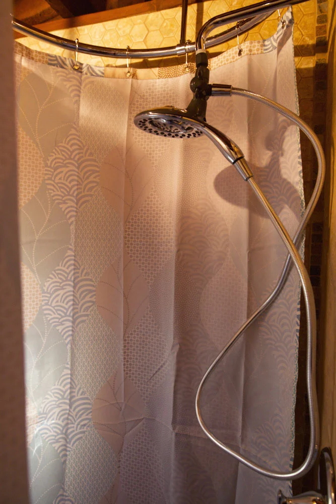 handheld massage shower combo with round curtain rod