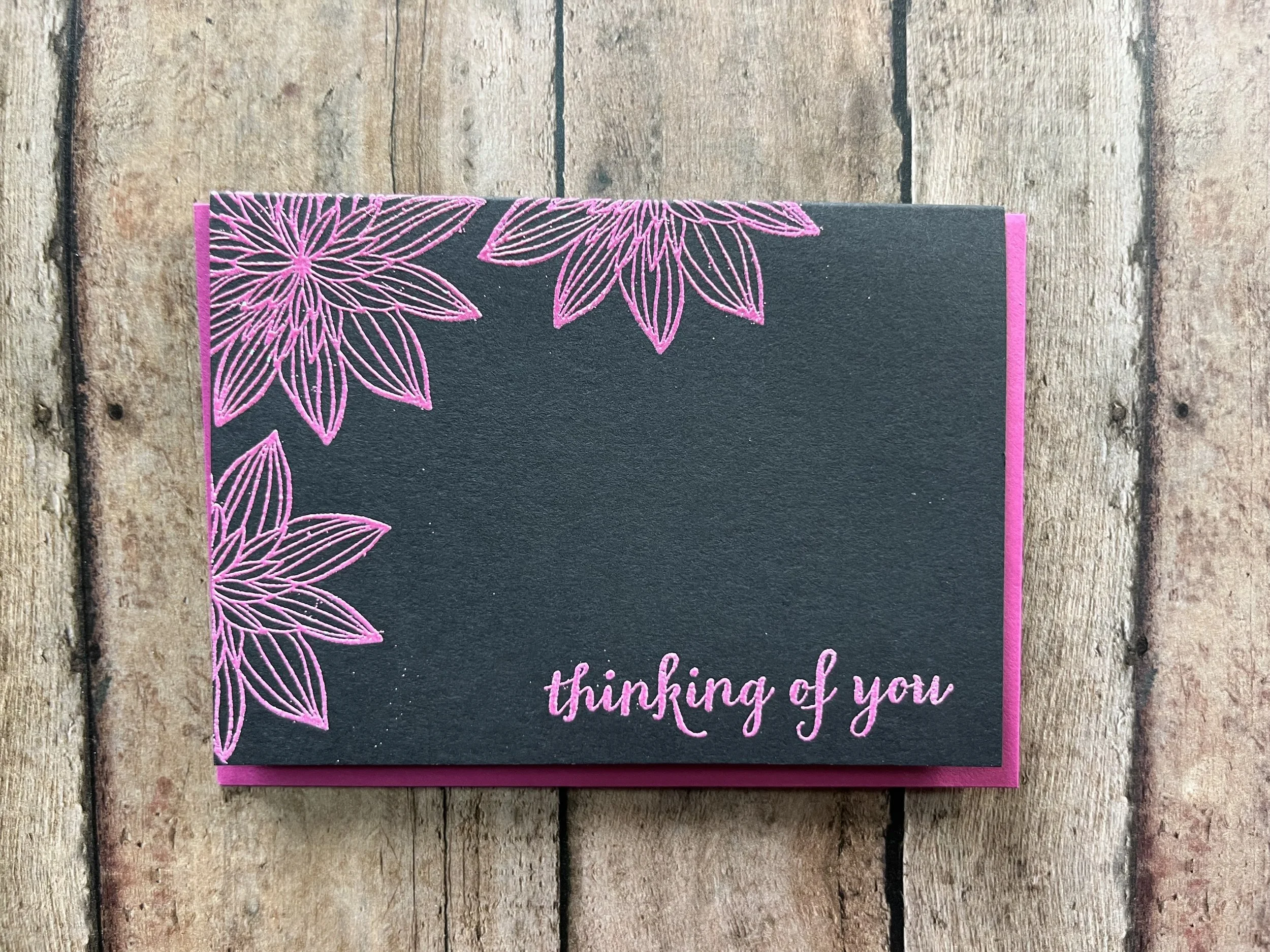 handmade eco-friendly "Thinking of You" greeting card with trio of night-blooming flowers in pink ink on black cardstock with matching envelope