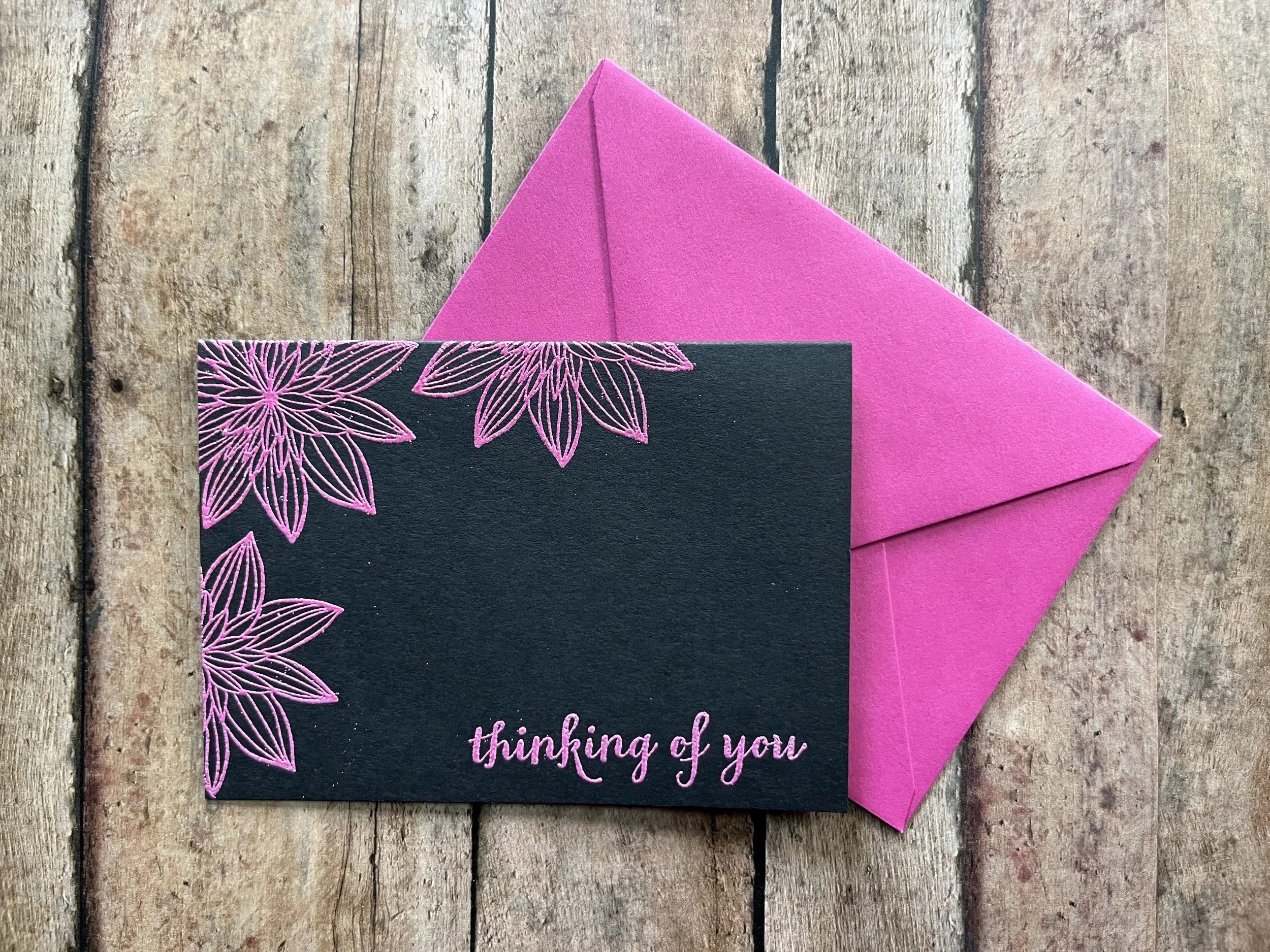 handmade eco-friendly "Thinking of You" greeting card with trio of night-blooming flowers in pink ink on black cardstock with matching envelope