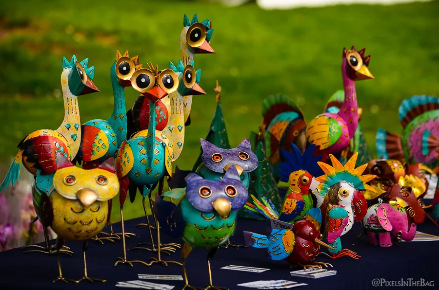 A selection of very colourful aviary garden decorations.
