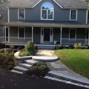Double walkway with a curved granite step