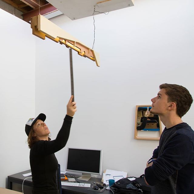 Design intern Louis discussing prototype #2 of the Stack light with Rebecca.  Made from CNC panel waste for the @rekindle_nz  Resource Rise Again project.