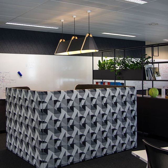 Frankie #Pendant in charcoal grey creates intimacy in a&nbsp;meeting space in Auckland's Tourism, Events, and Economic Development offices in Auckland.