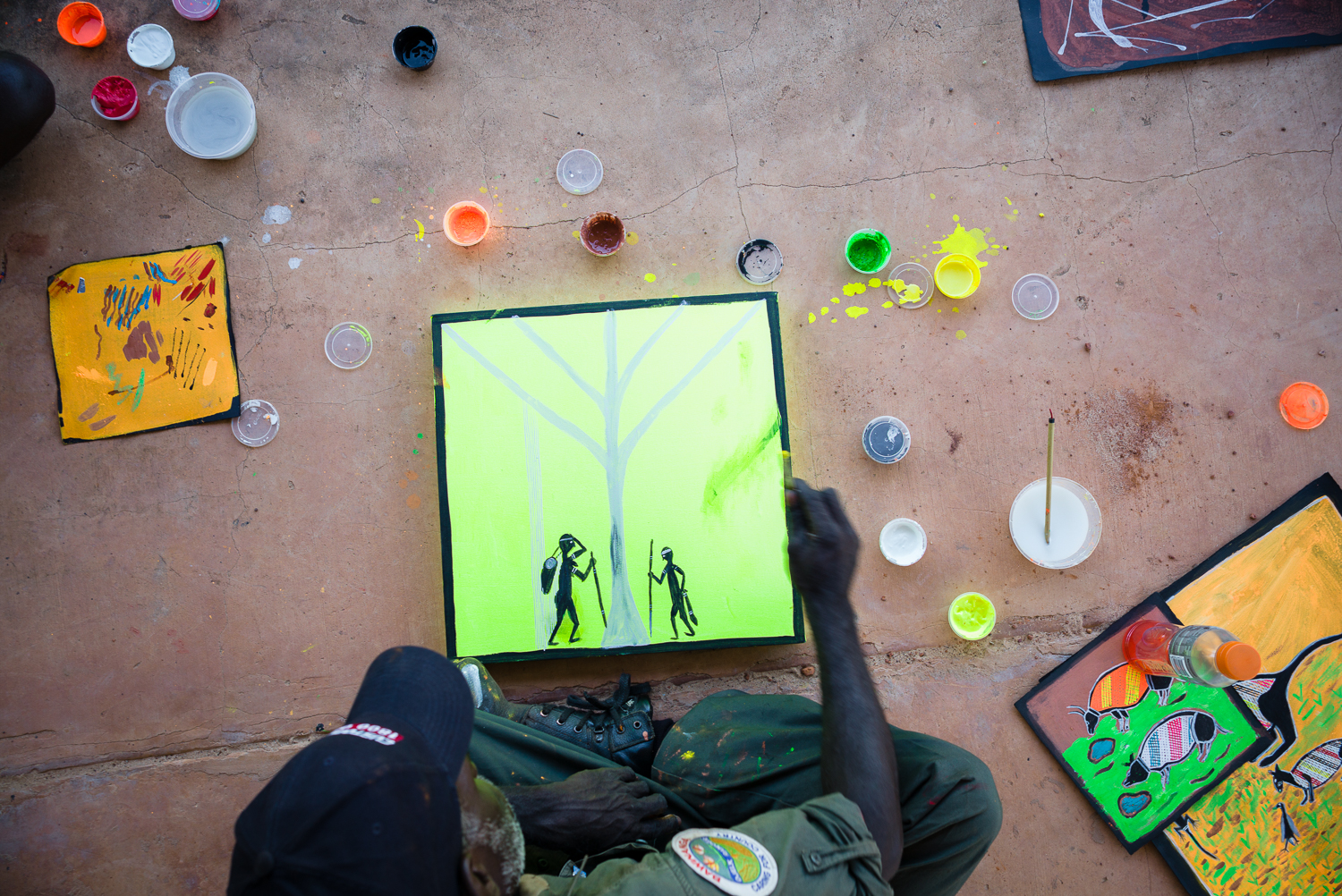 Ranger and artist Greg Wilson making a start on a fluoro masterpiece (photo by Hugo Sharp).