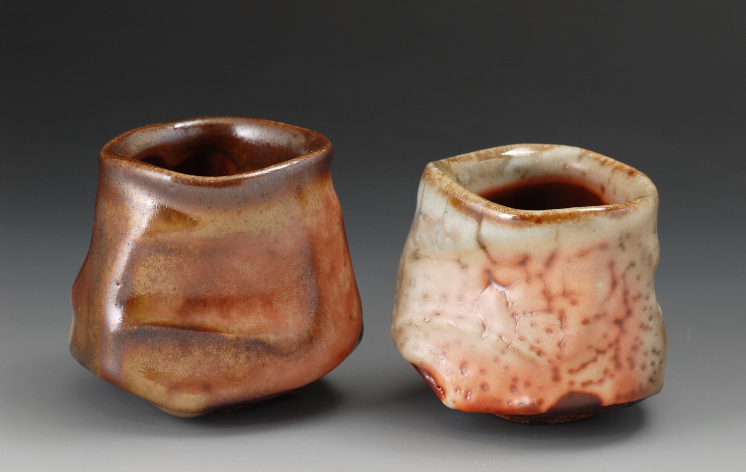 Faceted whiskey cups, shino glaze