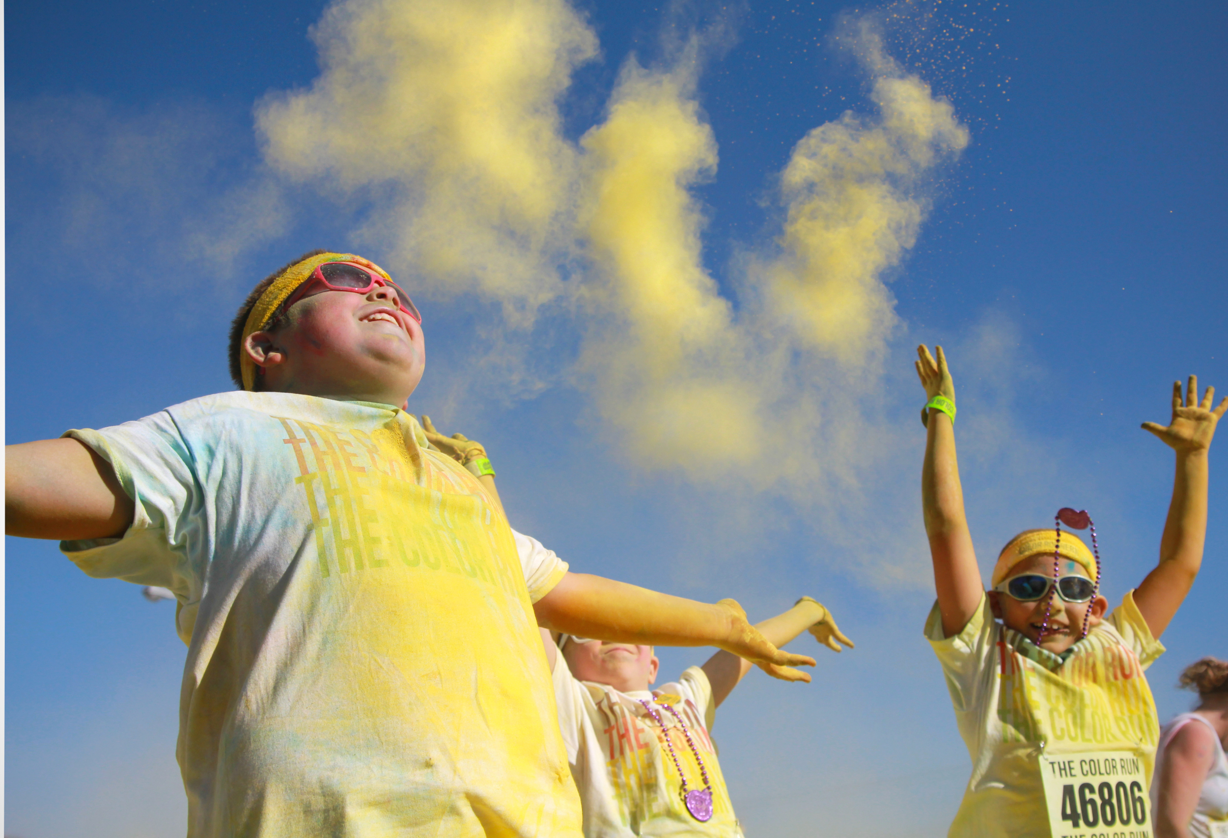  (Sept 2, 2011) Several participants of the St. Louis Color Run throw powdered paint in the air after completing the course. 