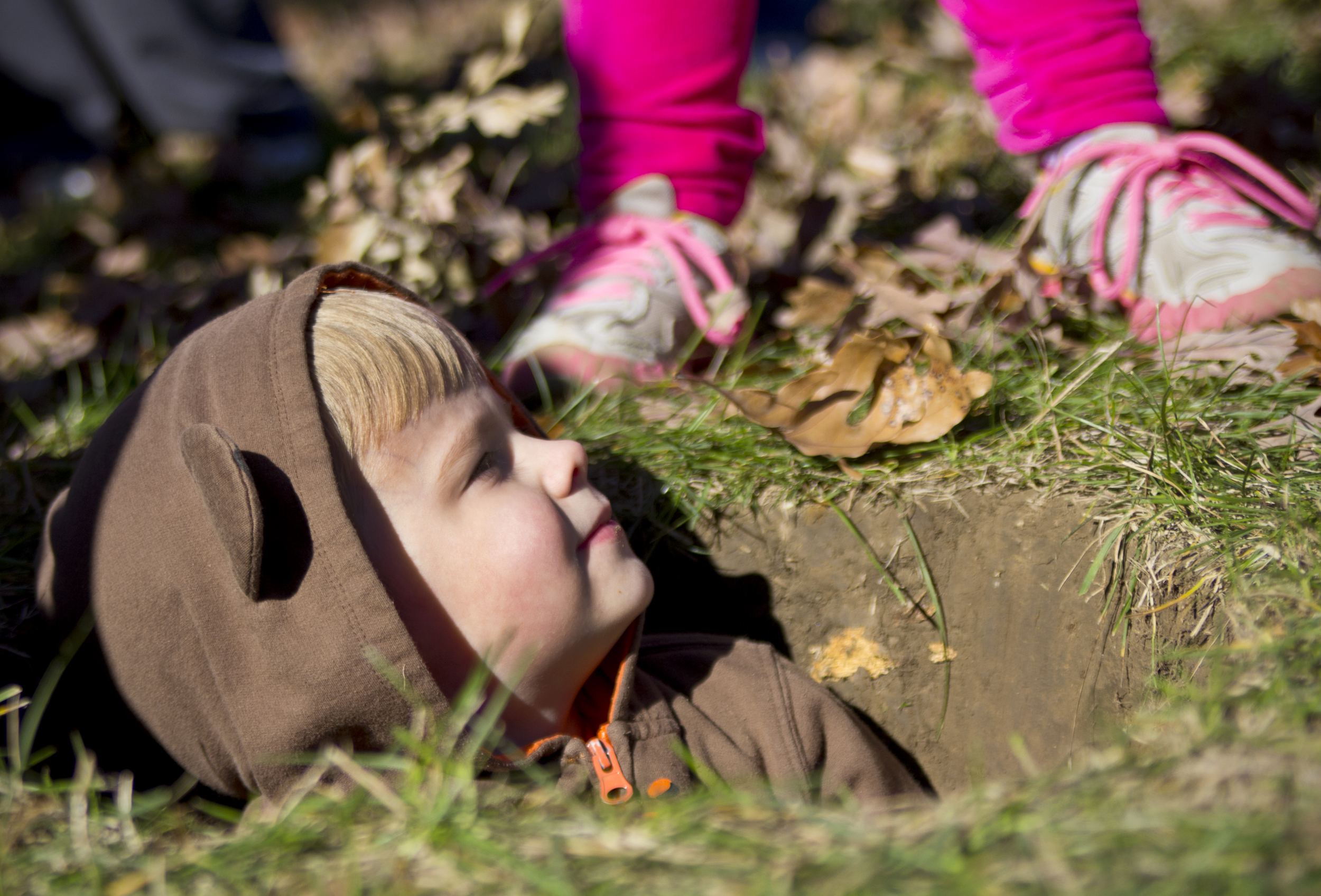  (March 22, 2014) Jared Kelly, 5, sits in a hole as students and families from Dennis Elementary School prepare the school's garden. 