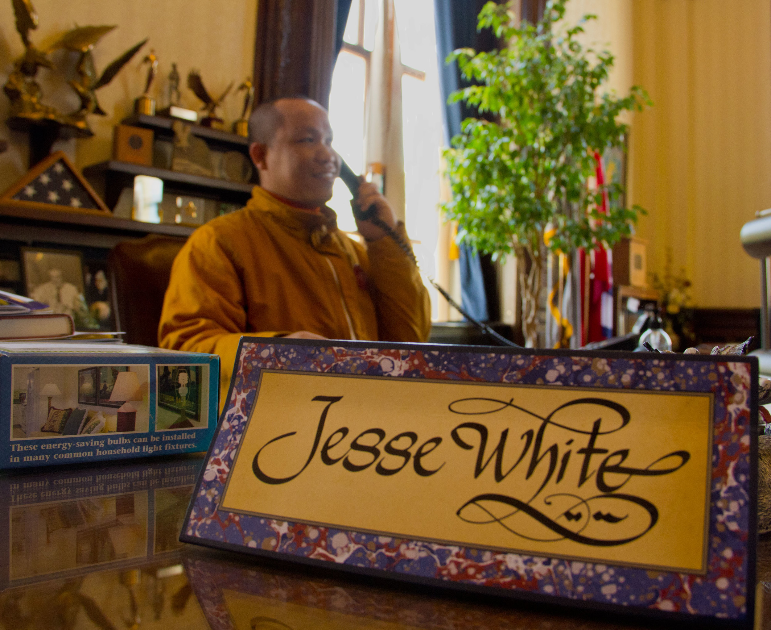  (April 20, 2012) A visit monk from Indonesia sits in the desk of Illinois Secretary of State Jesse White during a visit to the Illinois capitol in Springfield, Ill. 