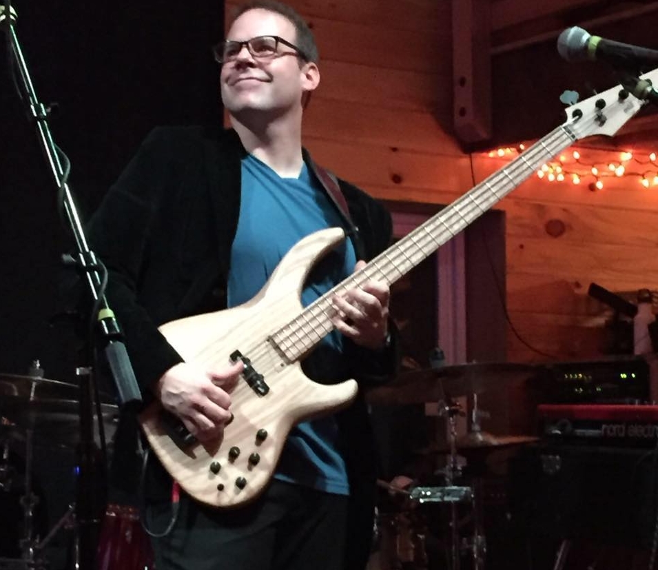 Since arriving to the Greater Binghamton area over 20 years ago, Thomas Westcott has had the opportunity to perform and learn from the area’s top musicians in the areas of jazz, blues and rock. A bass player since age 14, Tom first started performing with the Oneonta, NY based rock power trio “The Heard”. Upon his transition to the Binghamton area, he held the bass chair in the Broome Community College and Oneonta State Jazz Bands. Thomas auditioned and began a long tenure as the bass player for the Binghamton-based contemporary jazz/ fusion band “Cosa Nova”. During this time period, he also began working with the then “Blues Bandits”, which later became the blues, funk and soul band “Badweather Blues Band”. He was a part of this group for almost 14 years. While working with the Badweather Blues band Thomas was also a member of a number of bands including the Panigma Steel Drum Band, Island Hoppers Steel Drum Band, No Compromise, Home Brew, Miles Ahead Jazz Quartet to name a few. Currently Thomas holds the bass chair for his own improvisational jazz/funk outfit featuring former members from the Badweather Blues Band called "Ultra Vibe" and performs regularly with Mike Davis and the Laughing Buddha Episodes. Over the past few years he has performed with blues guitarists Michael Hill and Murali Coryell, Central New York singer/songwriter Jamie Notarthomas, NYC vocalist Glenda Davenport, jazz guitarists Eric Divito and Dennis Winge, and Grammy nominated guitarist and Gregg Allman musical director Scott Sharrard. Thomas performs records in the studio frequently on electric and double bass. You can hear samples of Thomas's studio work on recordings from the Badweather Blues Band (http://www.cdbaby.com/cd/badweather) , singer-songwriter Jared Campell ( https://itunes.apple.com/us/album/beyond-the-gray/id302170607 ) , the Miles Ahead Jazz Quartet album entitled "One Sunday", The Brian Golden Blues Experiment's "Binomial" ( https://briangoldenblues.hearnow.com/ ), Tim Ruffo's "Modern Day Outlaw ( https://www.israbox.pro/3137546668-tim-ruffo-modern-day-outlaw-2017.html ), Ultra Vibe's "A Moment in Time, Volume 1" and "A Moment in Time, Volume 1 LIVE" by Ultra Vibe ( https://ultravibe.bandcamp.com/releases ) , Mike Davis ( www.laughingbuddhaepisodes.com ) and Dennis Winge ( http://denniswinge.com ) Ultra Vibe: www.facebook.com/UltraVibe1 , twitter.com/ultravibemusic , https://ultravibe.bandcamp.com/releases Thomas is employed by the Owego-Apalachin Central School District as a School Counselor. Thomas, his wife and three children currently reside in Endwell, NY.