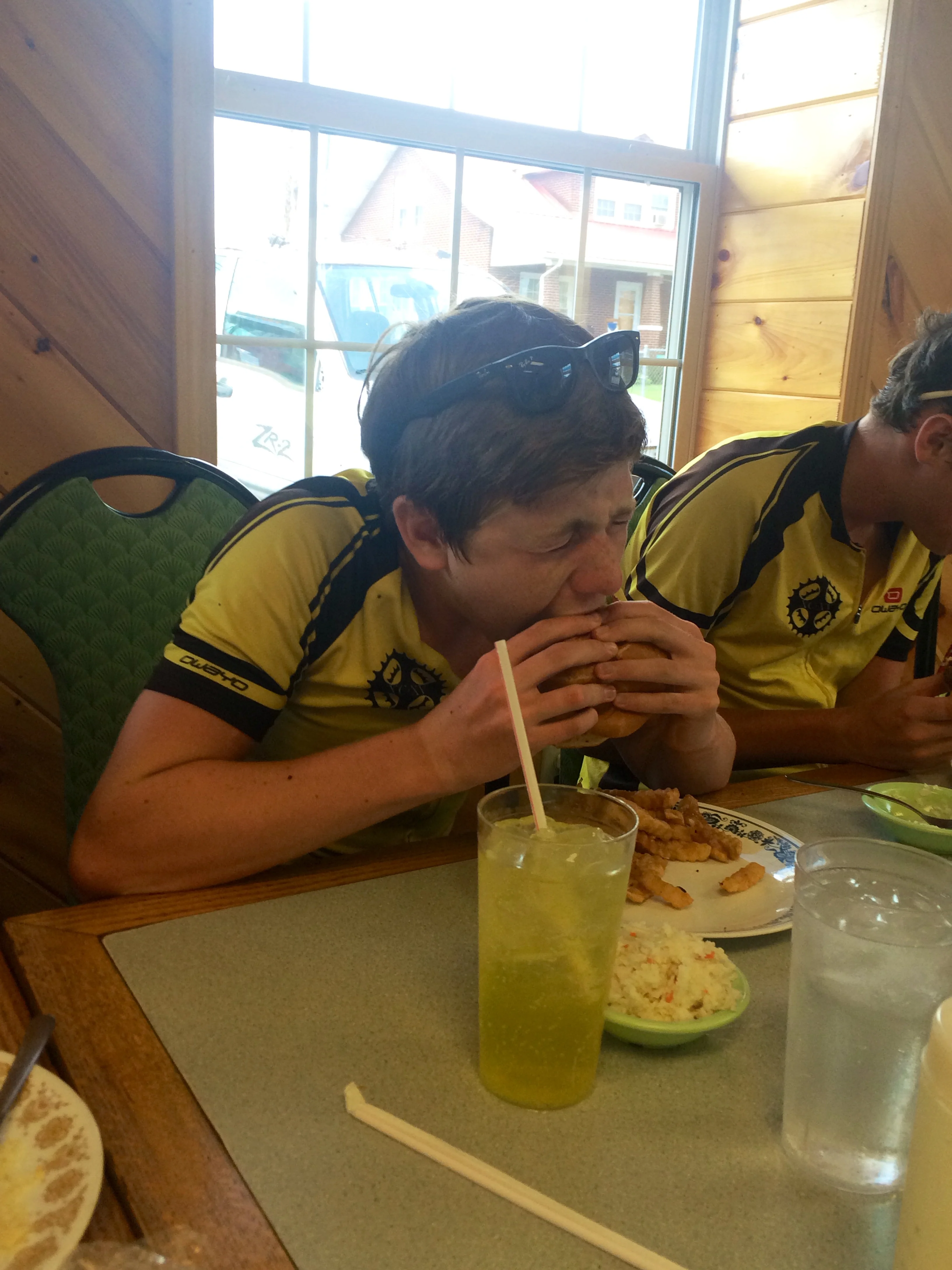 Will crushes his double cheeseburger, hold the cheese. Don't mind the cig smoke.