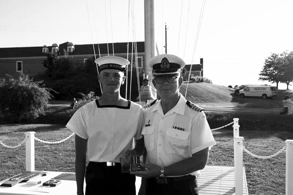 Petty Officer 2 Nicholas Smith receiving the Army, Navy and Air Force Veterans in Canada (ANAVETS) Cadet Medal of Merit. One of two awards he received this summer, from Commanding Officer of HMCS Acadia Brent Newsome. Submitted photo