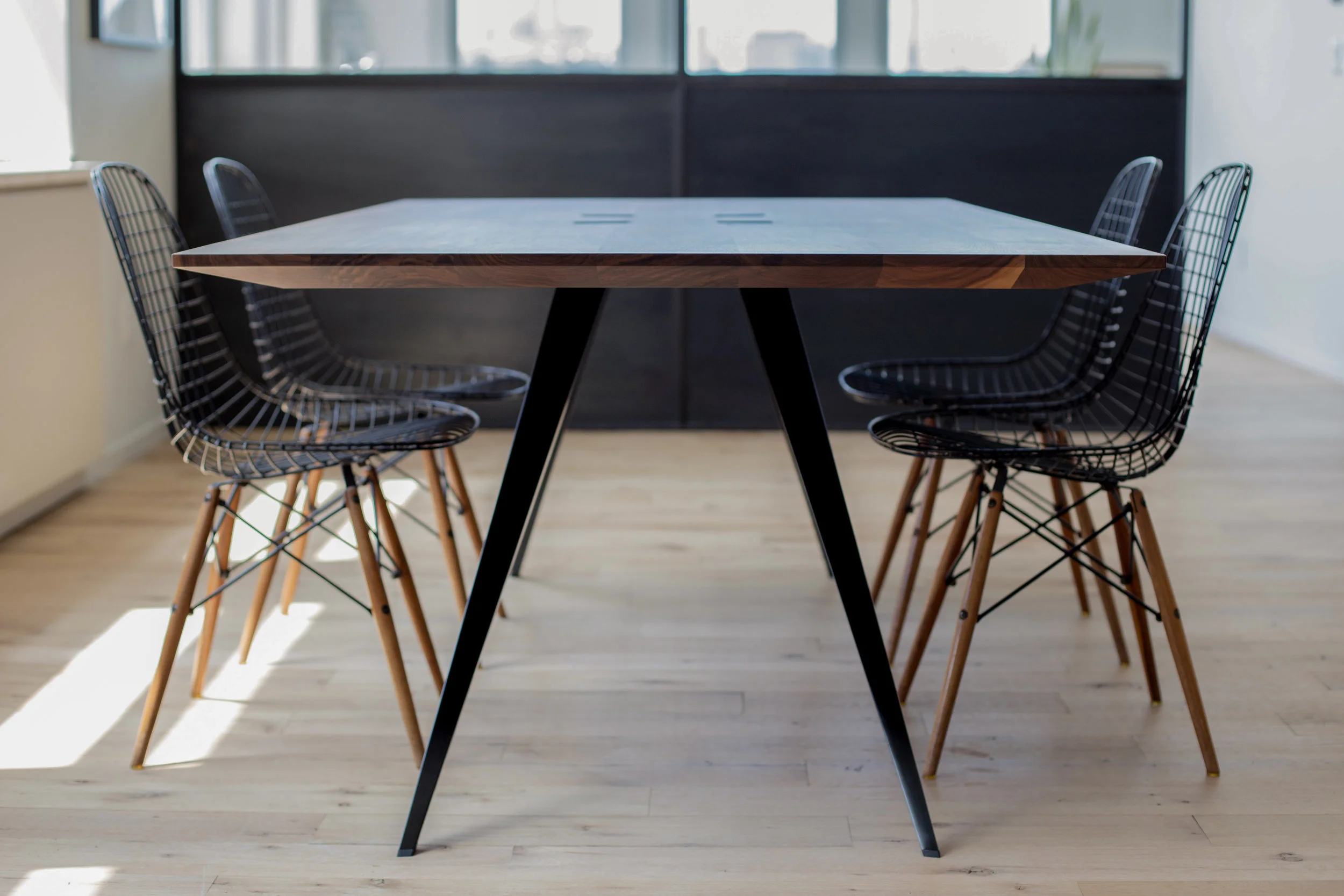 W42" x L80" x H28.5 Solid walnut top, pierced by 12 gauge blackened steel legs. 