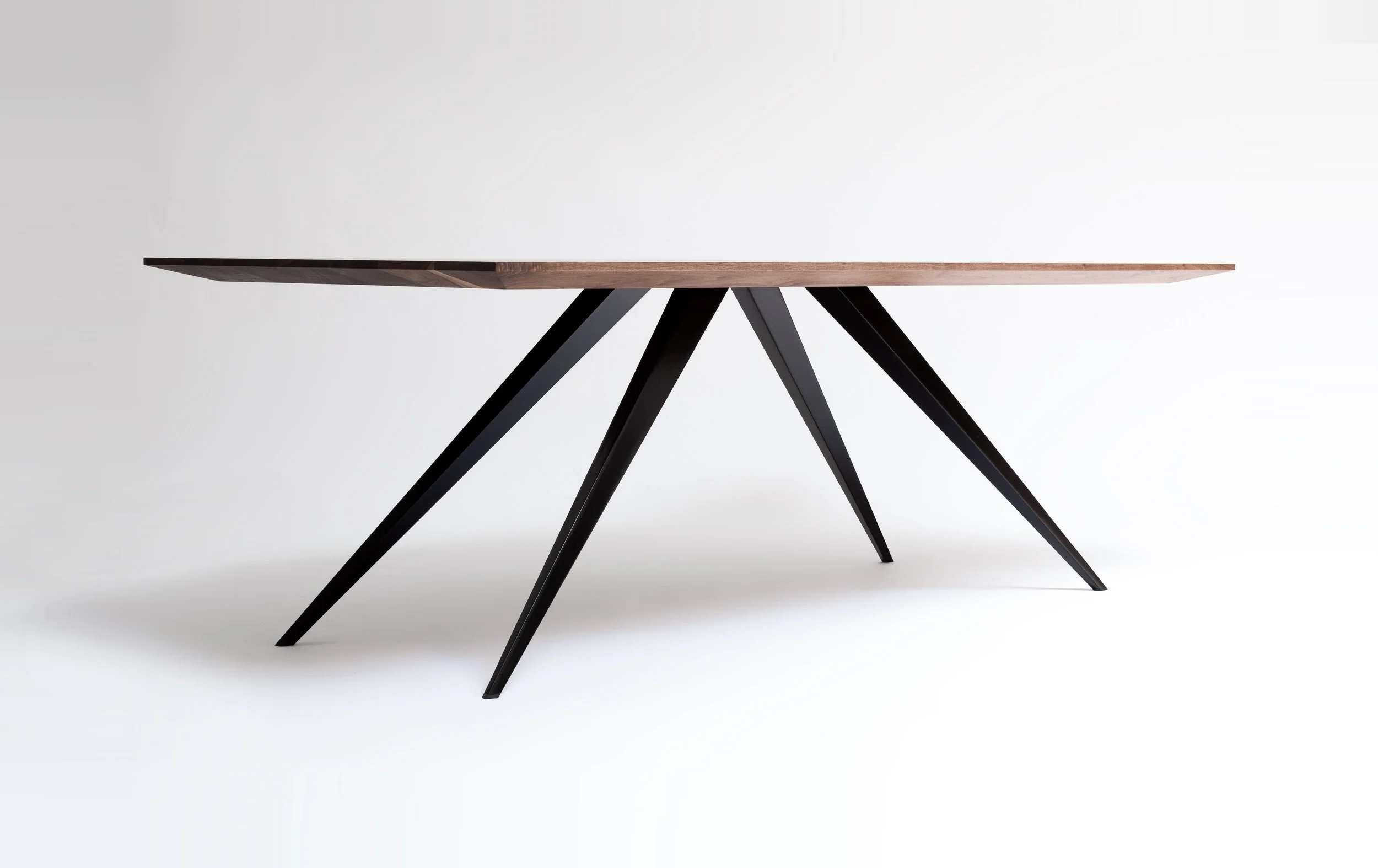 W42" x L80" x H28.5 Solid walnut top, pierced by 12 gauge blackened steel legs. 