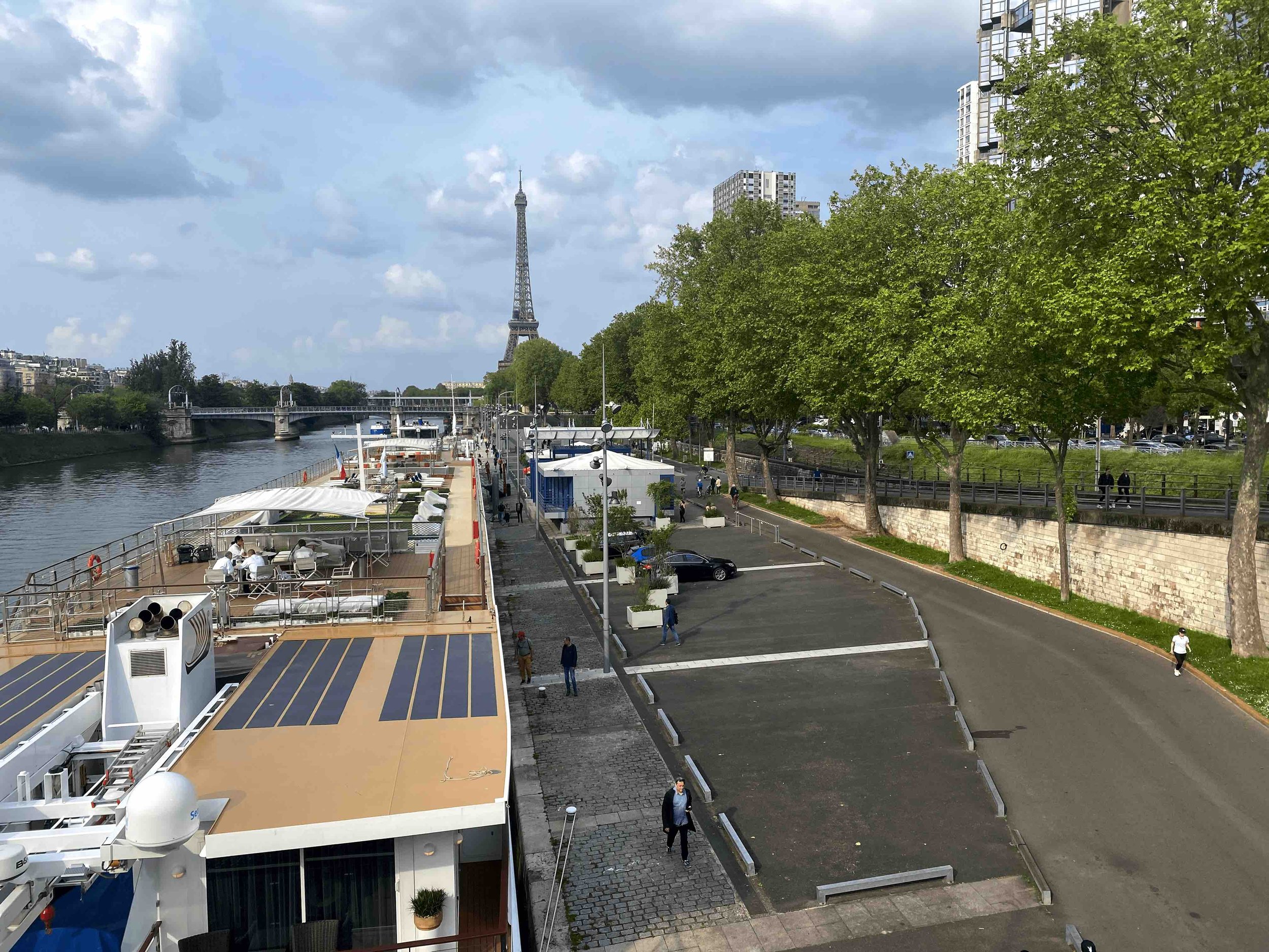  The immediate riverfront zone, encompasses several areas with specific functions. From left to right, these include the riverboat movement area, docking, and a pedestrian walkway. Following these areas is a multi-use zone which provides limited car 