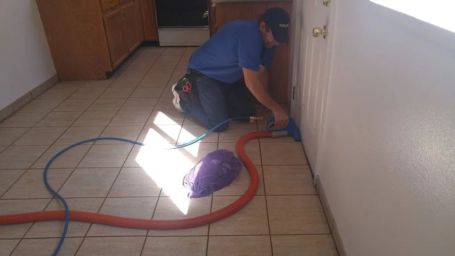 using a hand tool to clean the tile and grout in Utah County.jpg