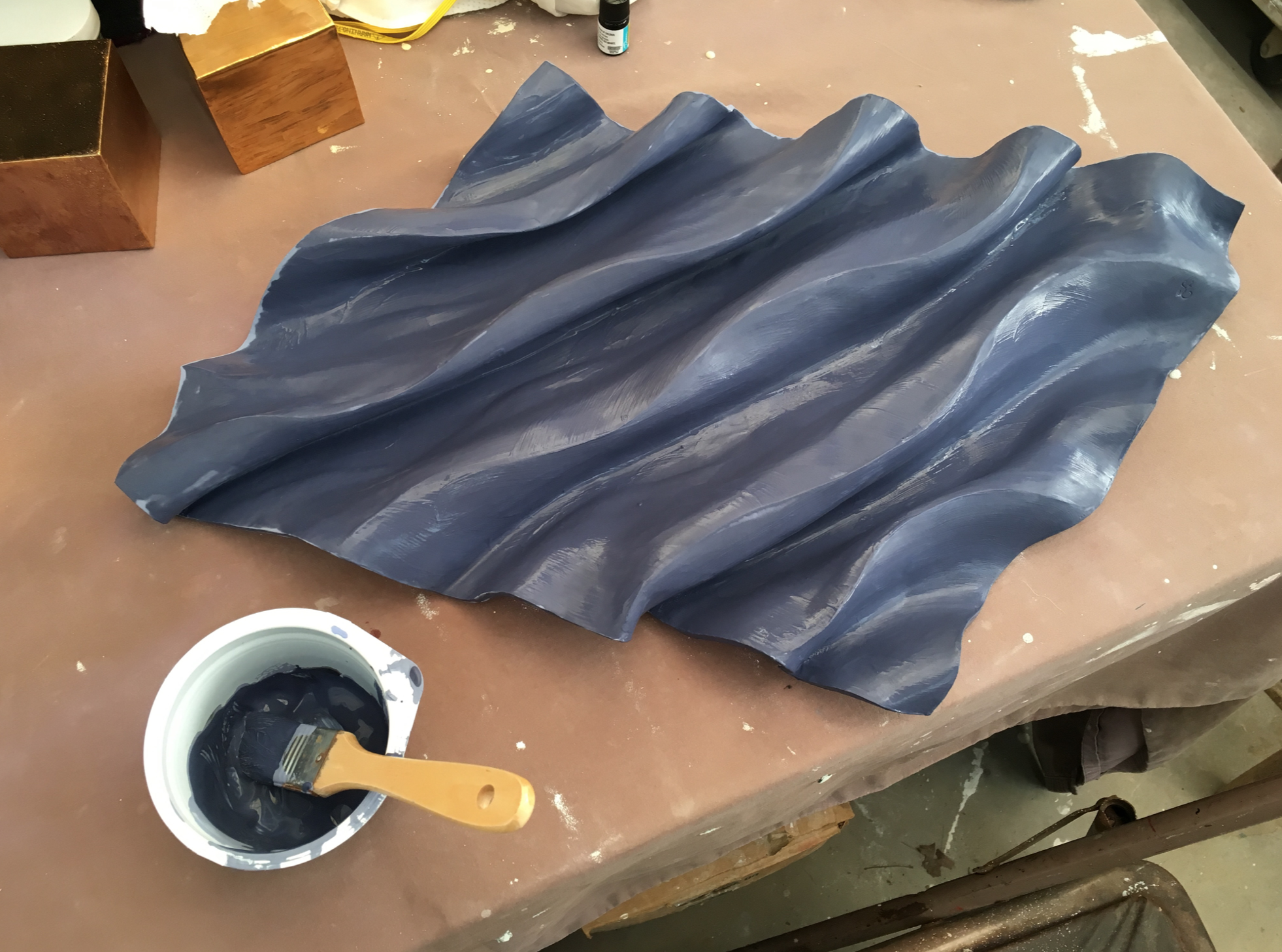 Applying glaze for the 2nd firing.