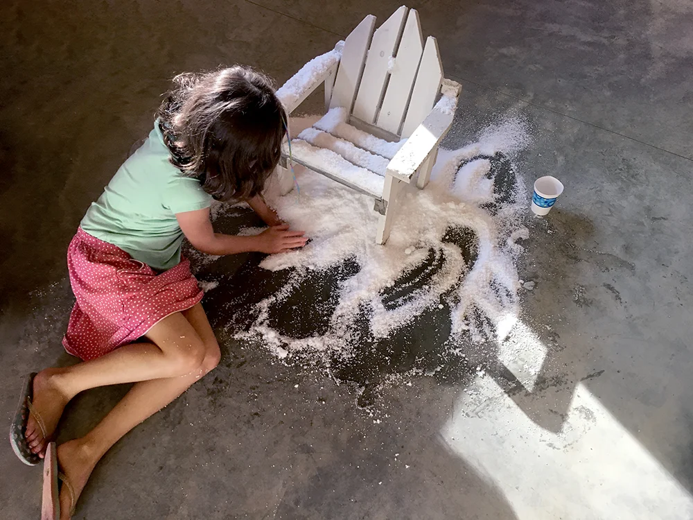 girl_playing_with_snow_installation.jpg