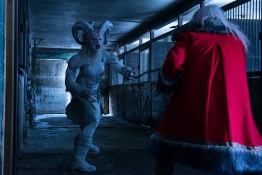 Krampus (left), the evil spirit of Christmas, in a climatic final showdown with Santa Clause. 