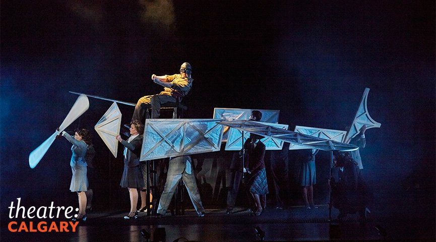 The opening sequence, where the ensemble members create the illusion of a plane in flight is theatrical magic. Photo courtesy of Trudie Lee.