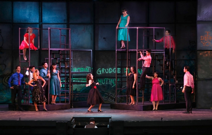 The talented cast (the Sharks are shown here), try to strut their stuff, despite being held down by the efforts of their director and choreographer. Photo credit: Tim Matheson.