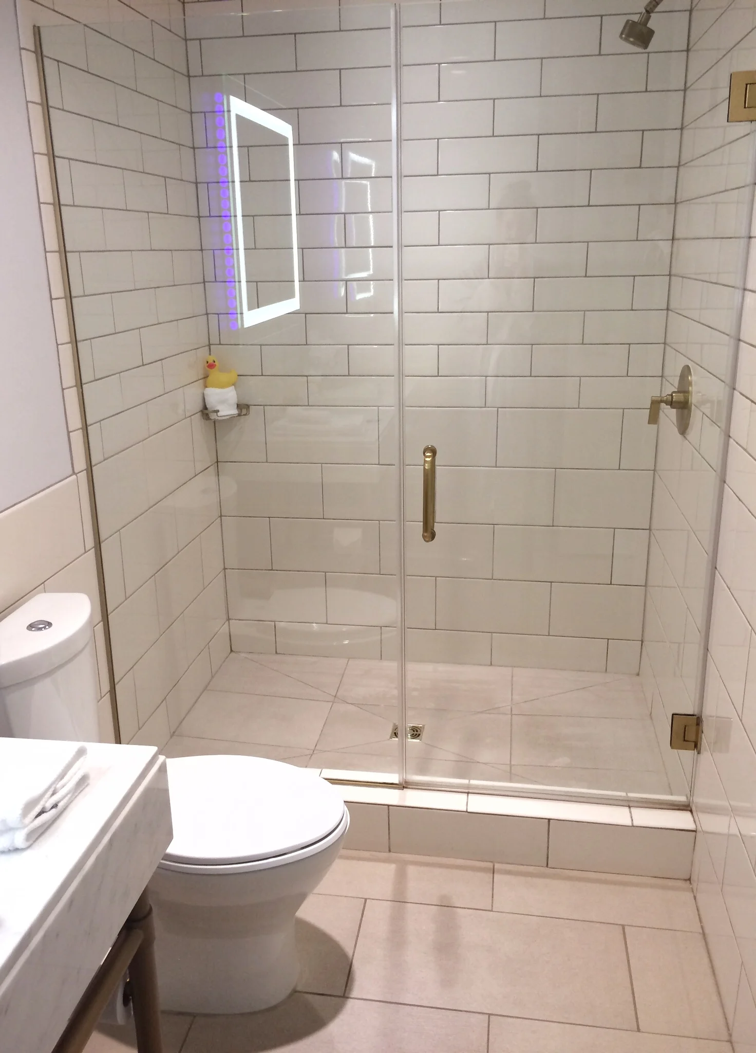 The light around the bathroom mirror created some serioulsy neat reflections in the shower. Plus you could seriously fit 10 people in that shower.