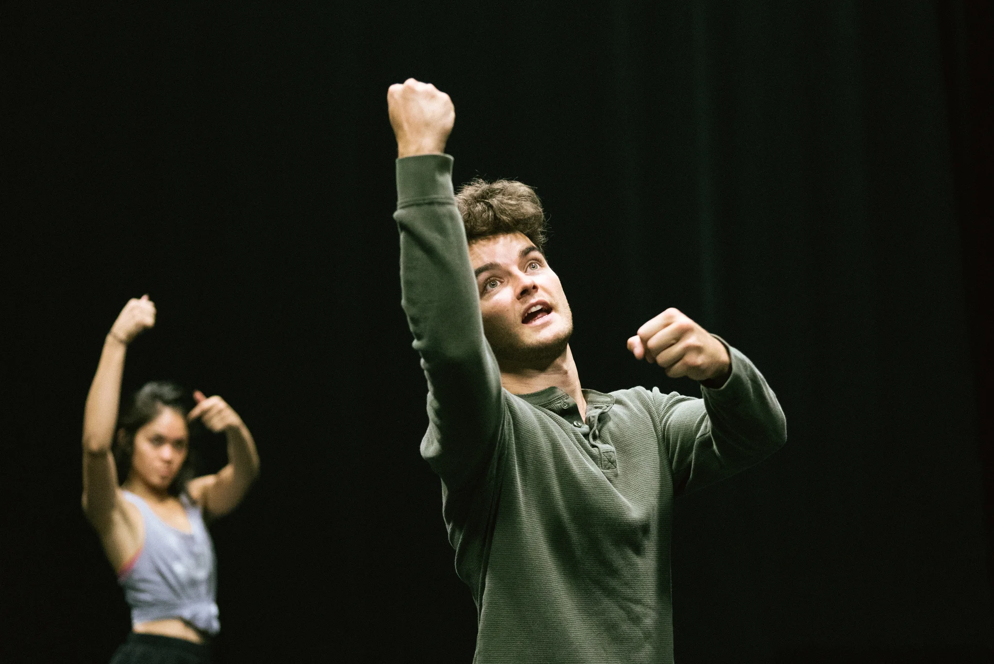 Dan Higgins coaches dancers on choreography.