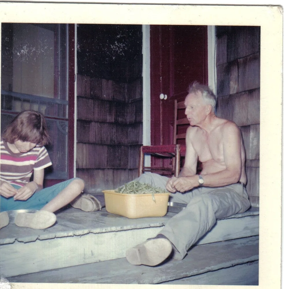 Leon Allen and a camper snapping beans