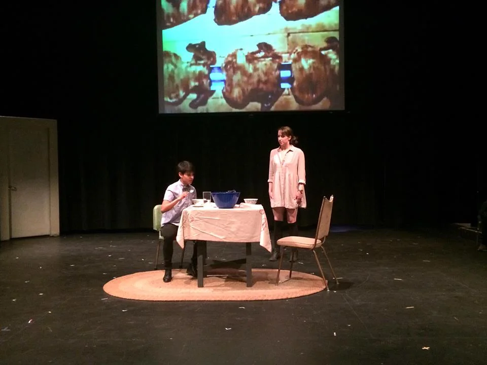 A scene from an-thro-poph-a-gy , at the Brave New Play Rites festival, March 2014 (Vancouver). Actors: Britt MacLeod and Angie Lopez. Directed by Jess Marlow.