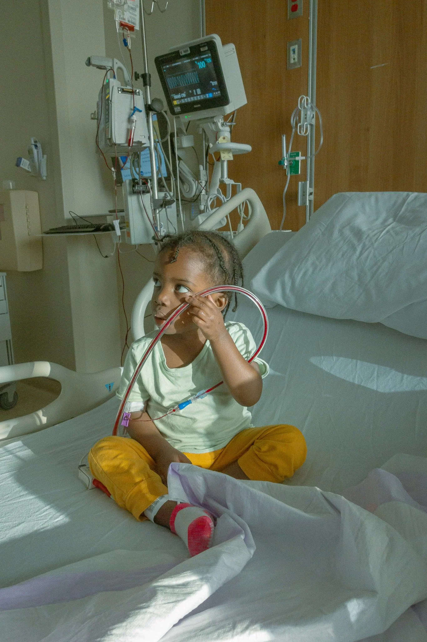 Title: First Blood Transfusion
Medium: Digital Photography
Dimensions: N/A
Year: 2024

Description:

First Blood Transfusion" explores the lived realities of sickle cell disease, critiquing systemic healthcare disparities while examining biological c