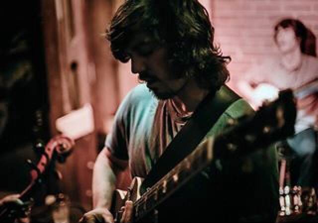 Colin on strings. Photo Credit: Levi Bechtel
